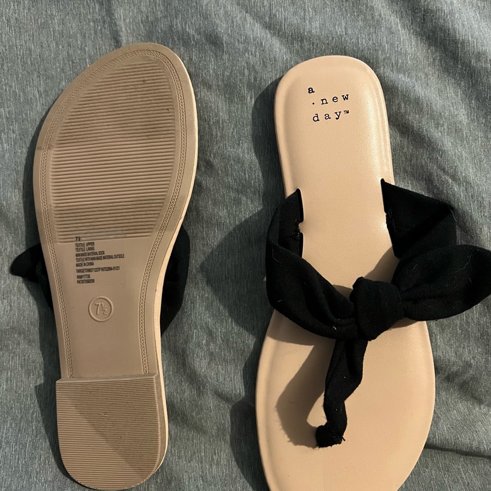 Target black fabric flip flops size 7.5